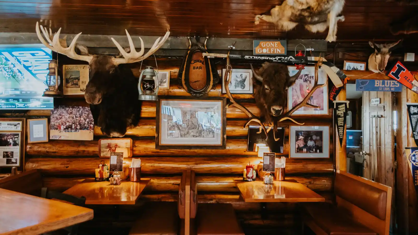 Decorations on the wall of the Corral Bar and Steakhouse including a buffalo head and moose head.