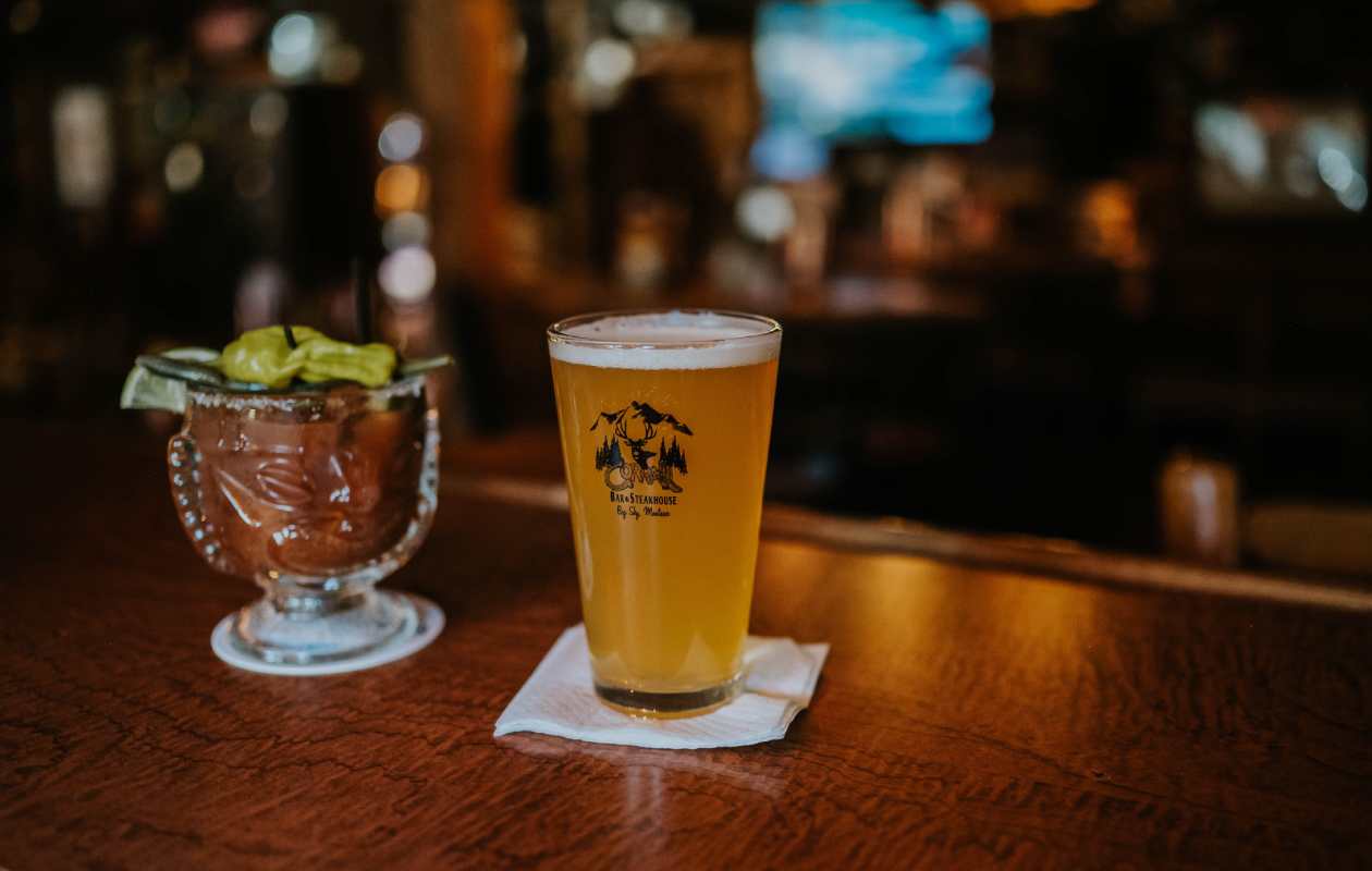 A cocktail and a beer rest on the bar at the Corral Bar and Steakhouse in Gallatin Gateway, MT.
